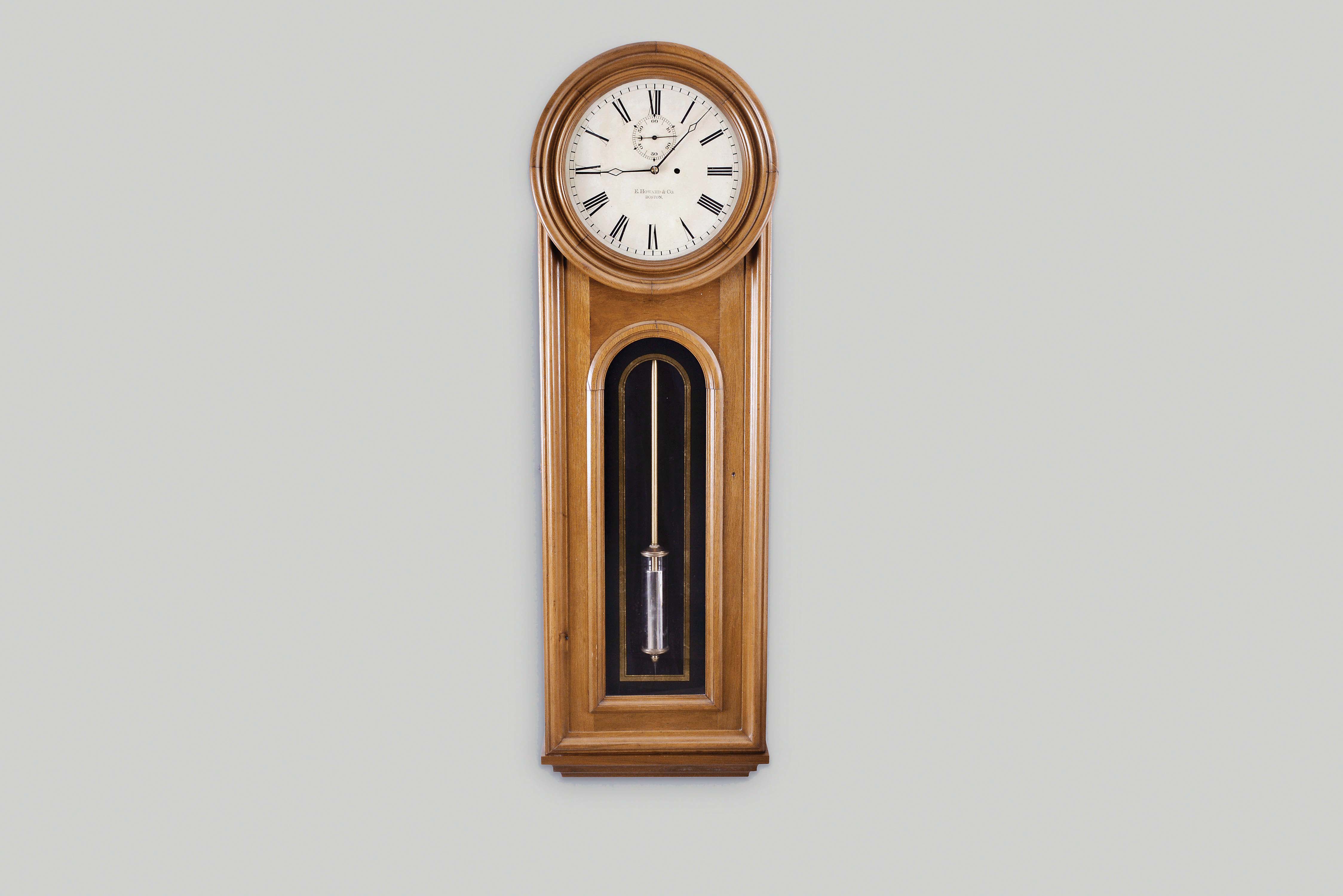 E. Howard &amp; Co., Boston, Mass., "No. 12 Regulator", wall clock, 8 day, time only, weight driven movement in a walnut case with a painted metal dial and reverse painted tablet — Antique Clocks Price Guide