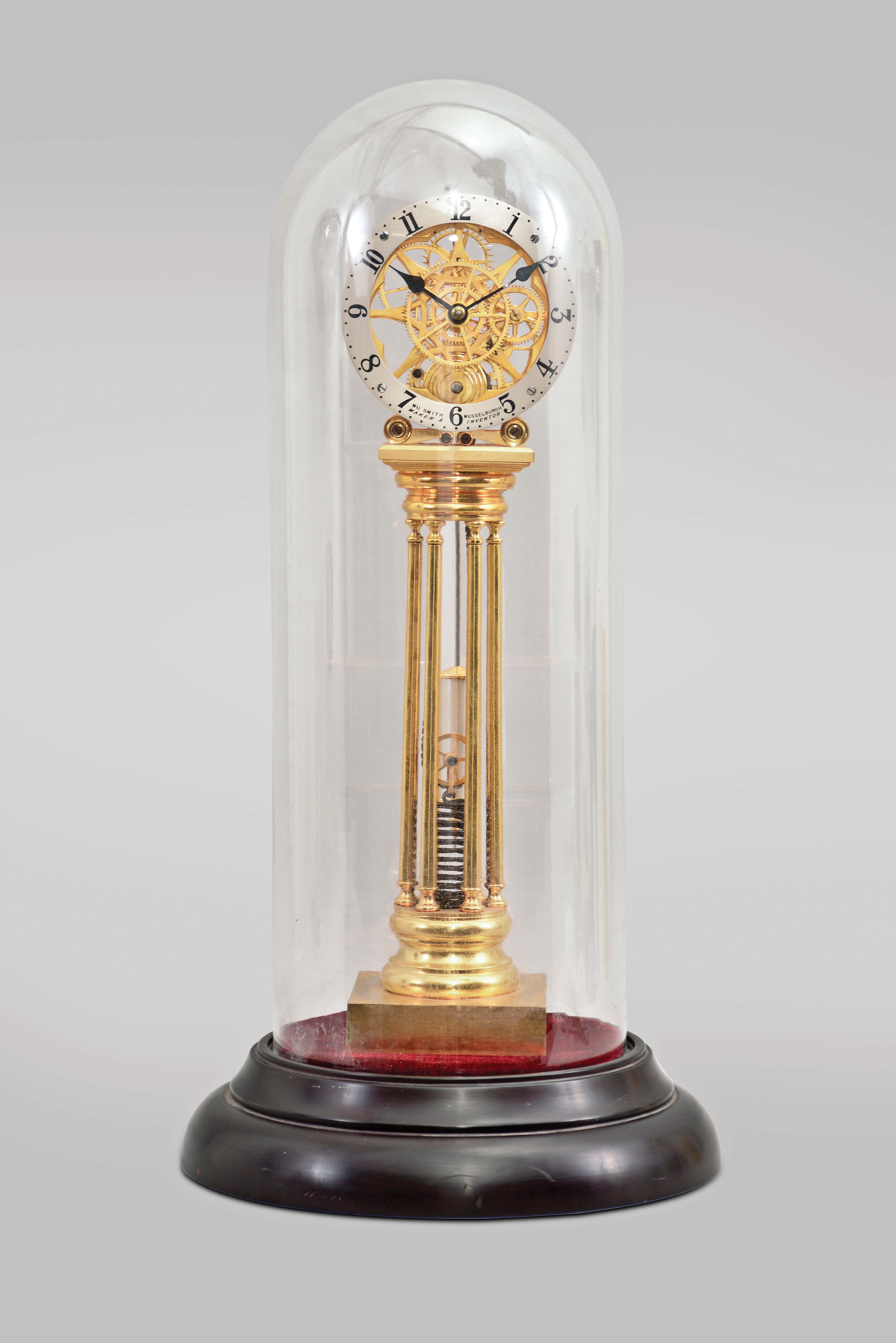 Asian, modern reproduction fusee skeleton clock under glass dome, 8 day, time only exposed movement powered by an extended coiled spring, silvered chapter ring reading "WU Smith, Musselburgh / Maker &amp; Inventor", mounted on a velvet-covered black molded base, late 20th century. — Antique Clocks Price Guide