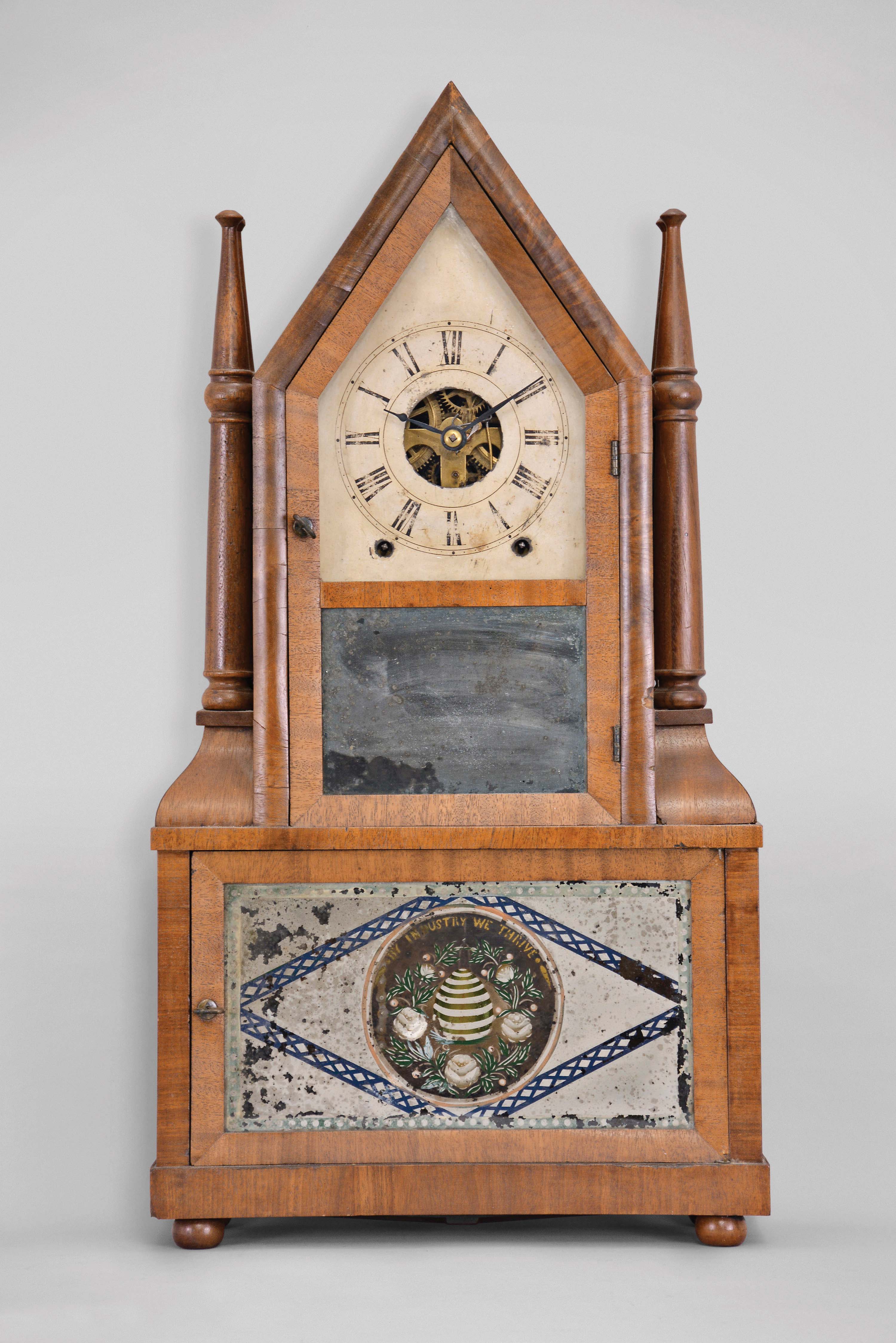 Birge &amp; Fuller, Bristol, Conn., 8 day, time and strike wagon spring driven brass movement steeple on frame with candle finials. — Antique Clocks Price Guide