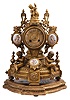Japy Freres, Paris, figural mantel clock, 8 day, time and strike, spring-driven, pendule de Paris movement in a cast spelter case signed "Ph. Mourey" having a Rococo base with two child figures blowing horns, three polychrome painted porcelain panels with putti figures, and topped by the figure of a child feeding grapes to a goat. Comes with associated wood base.
