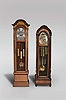 Tall Clocks- 2 (Two) Herschede Clock Co., Cincinnati Ohio, 8 day, time, strike and chime, weight driven movement with moon phase: (1) quarter hour chiming on gongs in cherry and glass case with ash burl highlights; (2) playing three tunes, Westminster, Whittington and Canterbury on 9 tubes in a mahogany case with satinwood highlights.