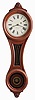 E. Howard & Co., Boston, Mass., "No. 9 Regulator", walnut "figure eight" style case with turned wooden bezel and lower door, reverse painted glasses in black, red, and gold, signed, Roman numeral painted dial with blued steel moon hands, and 8 day, weight driven timepiece movement