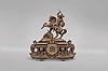 Ansonia Clock Co., New York, "Eureka (base) with Group No. 1099 (figure) " mantel clock with a spring driven, 8 day, time and half hour strike visible escapement movement in a bronze finished spelter and black enameled iron case.