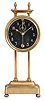 England, gravity clock, 30 hour, time only, weight driven movement with a visible escapement and compound pendulum on a molded brass base with rack gear integrated into upright pillars, white hands and numerals back painted on glass.