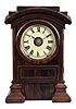 Seth Thomas Clock Co., Thomaston, Conn., "Arch Top" mantel clock, 8 day, time and strike with alarm, spring-driven movement in a burl walnut case with painted metal dial, c1880.