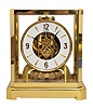Jaeger- LeCoultre, Switzerland, "Atmos" clock, 15 jewel movement, gilt torsion pendulum, square white painted dial with applied gilt Arabic numerals and arrow markers, gilt hands, all contained in a glazed rectangular case with removable front panel, serial #296852, c1983.