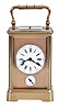 France, a petite sonnerie striking carriage clock with grand sonnerie repeating, polished brass Corniche case with bevelled glasses, the top engraved "J. K. Connally, Oct. 7, 1897", Roman numeral white enamel dial with gilt mask and subsidiary alarm dial, blued steel hands, 8 day, time, strike and alarm movement with lever platform, sounding the quarters in passing, and repeating the last hour and quarter on demand