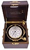 Hamilton Watch Co., Lancaster, Penn., model 21 marine chronometer, later converted to resemble the model 221, four orbit chronometer, 14 jewel key wind and set, straight line damascened nickel plate movement, with spring detent escapement and large, monometallic balance and helical balance spring, Arabic numeral metal dial with outer minute chapter, and subsidiary dials displaying day of the week, hours, seconds, and power reserve, black painted steel spade and poker hands, with gimbaled brass bowl, and mounted in a mahogany box with brass furniture, serial #2E10020