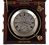 T.S. & J.D. Negus, New York, two day marine chronometer, 11 jewel fusee movement with spotted plates, Earnshaw's escapement, freesprung, cut bimetallic "H" balance, diamond endstone, and blued steel helical balance spring, Roman numeral silvered dial with wind indicator and gold spade and poker hands, contained in a gimballed, lacquered brass bowl, all in a three tier mahogany box with brass furniture, serial #2062