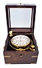Wm. Bond & Son, Boston, two day marine chronometer, 11 jewel fusee movement with decorative scraping, Earnshaw's escapement, freesprung, cut bimetallic "Z" balance, diamond endstone, and blued steel helical balance spring, Roman numeral silvered dial with wind indicator and gold spade and poker hands, with gimballed, lacquered brass bowl, and contained in a two tier rosewood box with brass furniture, serial #1028