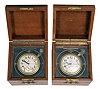 Deck watches- 2 (Two), Zenith / Vail Watch Co., 8 day, mounted chronometer watches, 15 jewel stem wind and set nickel movements, silvered dials with wind indicator and blued steel hands, contained in gimballed brass bowls, with 3 tier mahogany boxes