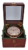 Dent, 82 Strand, London, two day marine chronometer, 11 jewel fusee movement with engraved broad arrow mark, Earnshaw's escapement, freesprung, cut bimetallic "Z" balance, diamond endstone, and helical balance spring, Roman numeral silvered dial with wind indicator, blued steel Breguet style hands, and seconds bit marked "With Airy's Compensation", housed in a gimballed, lacquered brass bowl, and contained in a two tier rosewood box with brass furniture and engraved plaque, with broad arrow mark, and "Dent, 1514, Two Days", serial #1514