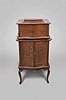 Regina Music Box Company, Rahway, N.J., "Style 50" table top music box, playing 15.5 inch discs on a double comb, short bed plate, spring wound movement in quarter sawn oak serpentine case with matching disc cabinet, with 35 discs including many waltzes.