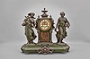 Ansonia Clock Co., New York, "Summer and Winter" double figural shelf clock with a spring driven, 8 day, time and strike visible escapement movement in a cast spelter case on a green enameled base.