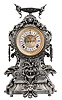 Ansonia Clock Co., New York, "Franconia" mantel clock with an 8 day spring driven time and strike movement with visible escapement and a cartouche dial in a silvered spelter case featuring flying gargoyles to the sides, a bird below the dial and profuse scrolls and swirls, surmounted by a winged urn.