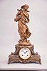 Ansonia Clock Co., New York, "Winter (figure) and Hebe (base) " figural shelf clock with a spring driven, 8 day, time and half hour strike movement in a bronzed spelter case.