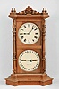 Seth Thomas Clock Co., Thomaston, Conn., "Parlor Calendar No. 8" shelf clock, 8 day, time, bell strike and perpetual calendar, spring driven movement in a walnut case with carved highlights and painted metal dials