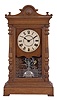 Seth Thomas Clock Co., Thomaston, Conn., "Atlas" shelf clock with a spring driven time and quarter strike movement in an oak case.