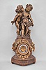 Ansonia Clock Co., New York, "Florida" base with figural "Group No. 1089" shelf clock, 8 day, time and strike, spring driven movement with visible Brocot escapement in a festooned fluted column topped by two children.