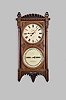 Seth Thomas Clock Co., Thomaston, Conn., "Office Calendar No. 5" wall clock, 8 day, weight driven movement with perpetual calendar in a walnut case with six burl spandrels on front door and lenticular aperture for pendulum bob and painted metal dials