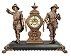 Ansonia Clock Co., New York, "Don Caesar and Don Juan" figural shelf clock with a spring driven, 8 day, time and half hour strike movement with visible escapement in an enameled iron base with two Japanese bronze spelter statues.