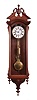 George A. Jones & Co., New York, hanging regulator, 8 day, time only, brass weight driven movement with sweep center seconds in a walnut, Vienna-style regulator case with Roman numeral white enamel dial and gridiron pendulum and brass bob