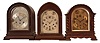 Clocks- 3 (Three) Chiming Mantel: (1) Herschede Clock Co., Cincinnati, OH, chiming mantel clock, 8 day, time and strike with Westminster chime playing on 5 rods, spring-driven movement, serial number 25093 in a round gothic mahogaNew York case, silvered dial with engraved floral motif, c1920; (2) Ansonia Clock Co., Brooklyn, New York, "Sonia No. 4" chiming mantel clock, 8-day, time and strike with Westminster chime in a lancet walnut case with arched silvered dial with raised bronze numerals and subsidiary dials for setting the rate and chime/silent, c1925; (3) Gustav Becker, GermaNew York, chiming mantel clock, 8 day, time and strike with Westminster chime, spring-driven movement in an arch top oak case flanked by barley twist columns, beveled glass door, dial with applied bronze numerals and subsidiary dials for rate adjustment and chime/silent selector, c1900.