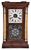 Seth Thomas Clock Co., Plymouth Hollow, Conn., "Column" shelf clock with a weight driven, 30 hour, time and strike movement in a mahogany veneered case with shell columns and gilt caps.