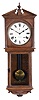 Seth Thomas Clock Co., Thomaston, Conn., "Umbria" hanging wall clock with a spring driven, 8 day, time and strike movement in an oak case.