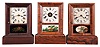 Clocks- 3 (Three): (1) Waterbury Clock Co., Waterbury, Conn., 8 day, time and strike, spring brass movement cottage clock. (2) Seth Thomas, Thomaston, Conn., 30 hour, time, strike and alarm spring brass movement cottage clock. (3) Seth Thomas, Thomaston, Conn., 30 hour, time and strike, spring brass movement cottage clock.