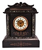France, mantel clock, 8 day, time only, spring-driven movement in incised black slate case on base with chamfered edges, supporting two full columns of green marble that flank a white porcelain dial with Arabic numerals and blued steel hands, the case topped with a frieze and pediment with matching green marble accents.