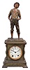 Seth Thomas Clock Co., Thomaston, Conn., "Whistling Boy" statue shelf clock with a spring driven, 8 day, time and half hour strike movement in a spelter case with a Syrian bronze finish.