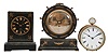 Clocks- 3 (Three) French Time-only Desk: (1) France, desk clock, 8 day, time only, spring driven movement with cylinder escapement on a black wood base with brass aviation-themed ornaments, 5 inch silvered dial with Roman numerals and blued steel hands. (2) France, desk clock, 8 day, time only, spring driven tic-tac movement with pendulum integrated with crutch in a black cast iron case with painted 4 inch dial and spade hands painted yellow. (3) France, desk clock, 8 day, time only, spring driven movement with cylinder escapement in a cylindrical brass case with ball fee and top ring holding a white enamel dial with Roman numerals and blued steel spade hands.