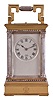 France, a gilt and silvered, Anglaise Riche cased hour repeating carriage clock, the architectural case with stepped, molded base and cornice, the corners with Corinthian columns, solid back with shutter for winding and setting apertures, and top with carrying handle, roman numeral silvered dial signed "Dent London", blued steel spade and poker hands, 8 day, two train movement with lever platform, striking the hours and half hour in passing, and repeating the last hour on demand
