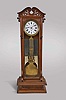 Standing Jeweler's Regulator retailed by M.L. Sheehan, New York, New York, 8 day, time only, weight driven movement with French pinwheel escapement, center seconds and gridiron lyre pendulum in a later custom built mahogany case with pierced and carved crest, white enamel dial.
