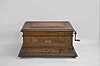 Regina Musical Box Co., Rahway, N.J., "Style 11a" 15.5 inch double comb music box with 10 discs, oak case with stepped ogee base and locking drawer, rope molding, stepped, molded lid, the inside with music-themed Regina lithograph, front metal plate reading "Murray, Spink Co. / Providence, R.I.".