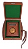 Hamilton Watch Co., Lancaster, Penn., model 22 chronometer watch with wind indicator, 35 size, 21 jewels, stem wind, pin set, adjusted to 6 positions and temperature, straight line damascened nickel plate movement, with lever escapement and micrometric regulator, Arabic numeral silvered metal dial, black steel spade and poker hands, serial #21697, the timepiece contained in mahogany boxes, the inner box with viewing aperture, c1940