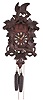 American Cuckoo Clock Co., Philadelphia, Penn., cuckoo wall clock with German 30 hour, time and gong strike with animated cuckoo bird, weight driven brass movement in a wood case featuring leaves, a prominent bird on top, and fox carved in the round after the grapes, a painted wood cuckoo bird with articulated beak and wings, and the dial with bone hands.