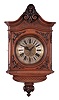 Gustav Becker, Freiberg, Germany, cartel clock, 8 day, time only, spring driven movement in a walnut veneered case in the second baroque style with carved scrolls and floral elements with a roman numeral silvered brass dial, and pieced blued steel hands.