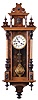 Clocks- 3 (Three) wall clocks, Germany, 8 day, time and strike: (1) Spring driven in walnut case with a fancy metal pendulum; (2) Spring driven in a walnut case; (3) Three weight, chiming Vienna regulator in a dark finished case