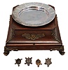 A. Cadot, Place Dauphine, Paris, a mahogany, gilt bronze mounted, floating turtle mystery clock, the case with square base on cast scroll feet, the upper portion with incurved sides with bronze mounts and molded top, supporting a water filled pewter bowl, the rim with engraved roman numerals, and arabic 15 minute markers, the turtle floating, and indicating the time, driven by a magnetic ring attached to the timepiece movement with lever platform concealed in the base, the back plate signed Samuel Marti, the front with Cadot's mark