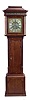Thomas Moss, Frodsham, England, tall clock, 8 day, time and strike, weight driven movement in an oak case with mahogany banding, bell top, four full reeded Corinthian columns on the hood with painted foliate frieze above dial, reeded quarter columns flanking trunk door. The brass dial has brass corner spandrels, silvered chapter ring and silvered center boss with maker's signature and seconds bit and surrounded by brass calendar ring indicated by hand off of center arbor.