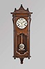 Seth Thomas Clock Co., Thomaston, Conn., "Marcy" wall hanging clock with an 8 day, 3-train, spring driven, time and strike movement with cathedral gong strike on the hour and quarter hour striking on 2 cup bells in a walnut case.