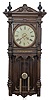 Waterbury Clock Co., Waterbury, Conn., "Atlanta", 8 day, time and strike, weight driven brass movement free swinging wall clock.