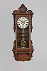 William L. Gilbert Clock Co., Winsted, Conn., "Newport" hanging clock with a spring driven, 8 day, timepiece movement in a walnut case.