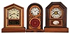 Clocks- 6 (Six): (1) Seth Thomas Clock Co., Thomaston, Conn., "Victoria" shelf clock with a spring driven, 8 day, time and strike movement in a rosewood veneered case, c1880. (2) Seth Thomas Clock Co., Thomaston, Conn., "Kitchen" shelf clock with a spring driven, 30 hour, time and strike movement in a mahogany veneered case, c1875. (3) Ingraham Clock Co., Bristol, Conn., "Venetian No. 3" shelf clock with spring driven, 8 day, time and strike movement in a mahogany veneered case, c1875. (4) Jerome & Co., New Haven, Conn., shelf clock with a spring driven, 30 hour, time, strike and alarm movement in a rosewood veneered case with decorative gutta percha tablet, c1875. (5) E. N. Welch Mfg. Co., Forestville, Conn., "Thursby" shelf clock with a spring driven, 30 hour, time and strike movement in a walnut case, c1890. (6) Seth Thomas Clock Co., Thomaston, Conn., "Giant, No. 2" shelf clock with a spring driven, 8 day, time, strike and alarm movement in an oak case, c1904.