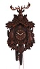 Clocks- 5 (Five) German & American wall: Three German two-weight cuckoo clocks, two by George Kuehl & Co. and two signed. One small German novelty clock with enameled dial. One cuckoo clock by the Lux Clock Mfg. Co., Waterbury, CT.