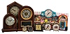 Clocks- 9 (Nine): (1) Seth Thomas Clock Co., Thomaston, Conn., "Prospect No. 17" shelf clock with a spring driven, 8 day, time and half hour strike movement in a mahogany veneered case, c1917. (2) New Haven Clock Co., New Haven, Conn., "Tuscan" shelf clock with a spring driven, 8 day, time and strike movement in a rosewood veneered case, c1880. (3) Seth Thomas Clock Co., Thomaston, Conn., unidentified model shelf clock with a spring driven, 8 day, time, strike and alarm movement in a rosewood veneered case, c1870. (4) New Haven Clock Co., New Haven, Conn Diner novelty clock with a battery operated quartz movement in a plastic case., c1955 (5) Gilbert Clock Co., Winsted, Conn., "Aussie's" alarm clock with a 30 hour, time and alarm movement in a metal case, c1930. (6) Lux/Robert Shaw alarm clock, c1950. (7) Mickey Mouse alarm clock c1960. (8) Western Clock Co., LaSalle, Illinois, "Baby Ben" alarm clock in a nickel plated case, c1922. (9) Western Clock Co., LaSalle, Illinois, "Baby Ben Deluxe" alarm clock in a nickel plated case
