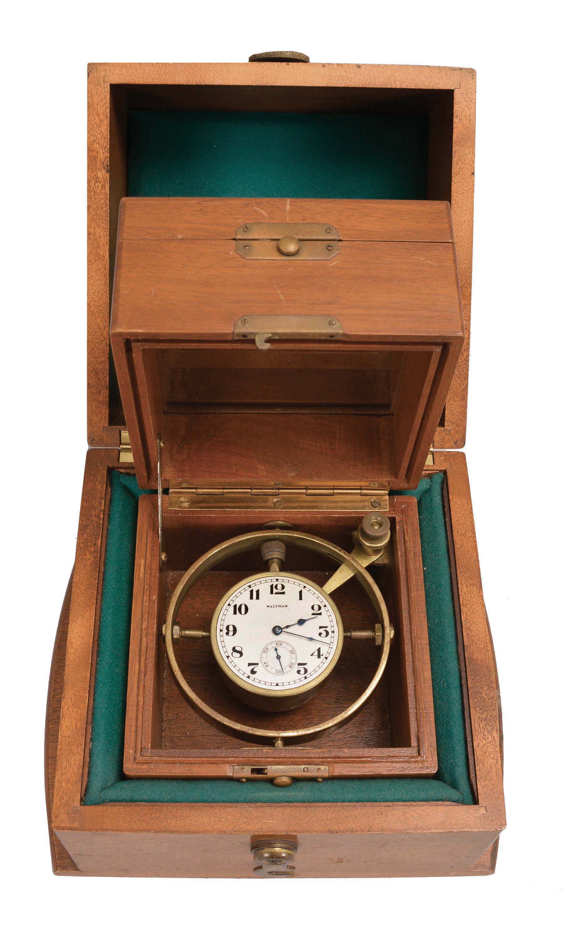 American Waltham Watch Co., a gimbal mounted deck watch with boxes, 17 jewel, model 1883 movement, serial #4771411, with arabic numeral metal dial and blued steel hands, in a brass bowl with gimbals, and mahogany 3 tier box, all contained in a padded, mahogany outer box — Antique Clocks Price Guide
