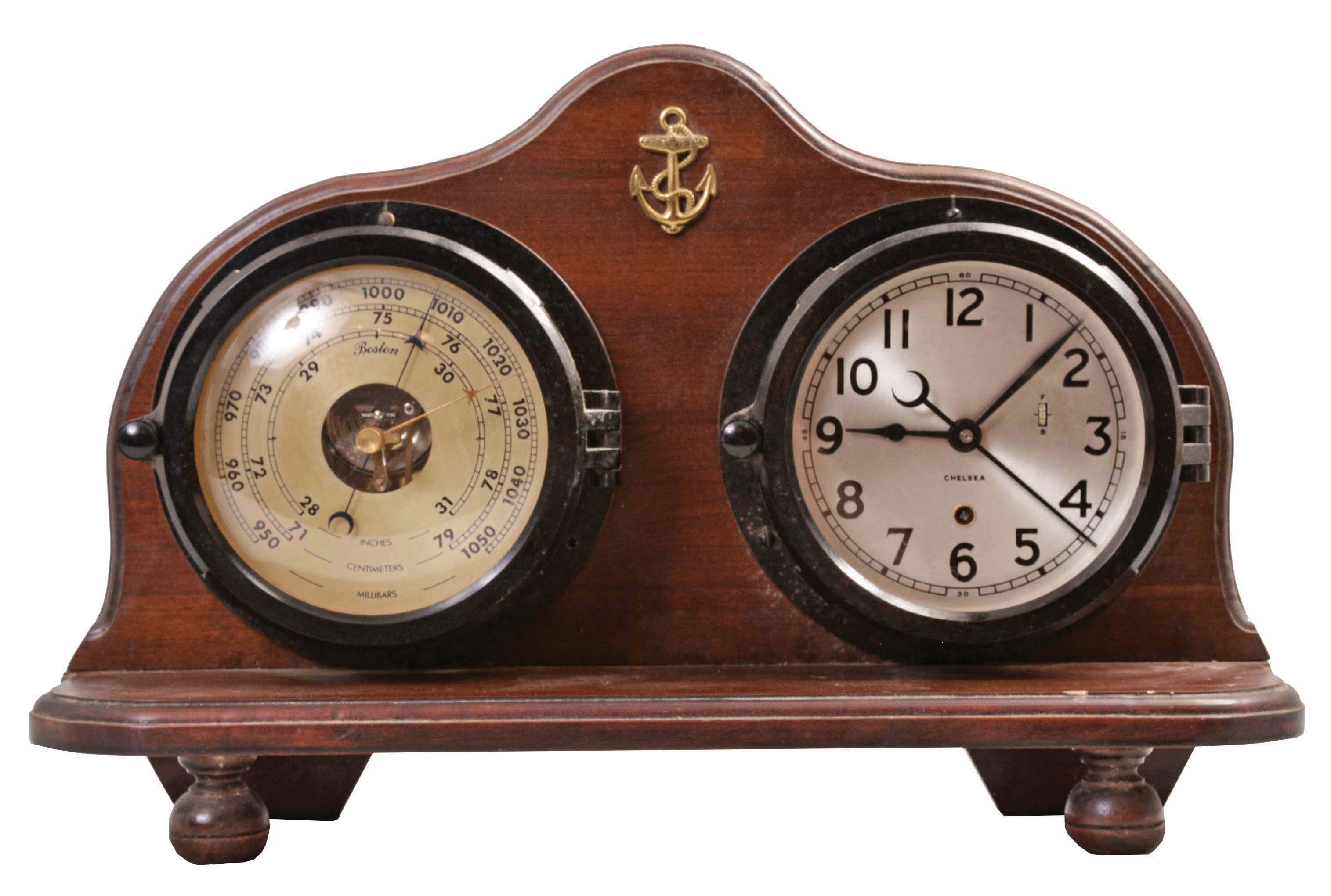 Chelsea Clock Co., Boston, Mass., timepiece and barometer set, 8 day, time only, spring driven, jeweled movement with a lever escapement, center seconds, in a black phenolic case with silvered dial, aneroid barometer in a matching phenolic case under Chelsea's "Boston" label, both mounted to a walnut base. — Antique Clocks Price Guide